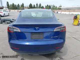 2021 Tesla Model 3 Long Range with VIN 5YJ3E1EB6MF878411, listed as a IAAI auction lot 41986947 with 71,978 mi miles. Bid and sale history available at carsss.com. Image 17.