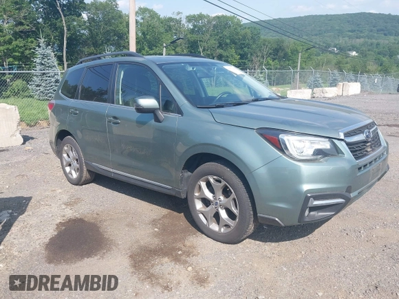 2017 Subaru Forester Touring with VIN JF2SJAWC8HH579492, listed as a IAAI auction lot 42571986 with 57,228 mi miles and . Bid and sale history available at DreamBid. Image 1.