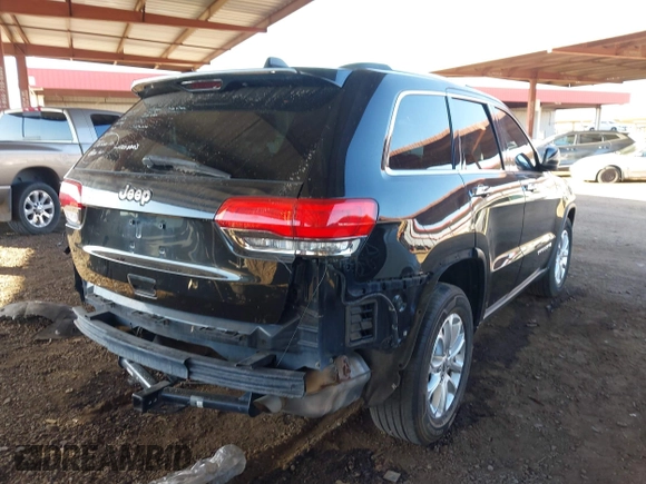 2014 Jeep Grand Cherokee Laredo with VIN 1C4RJEAG3EC472714, listed as a IAAI auction lot 40980100 with 124,603 mi miles. Bid and sale history available at carsss.com. Image 4.