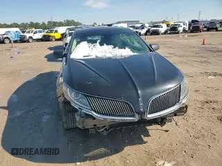 2014 Lincoln MKS z VIN 1LNHL9DK3EG606655, wystawiony jako Copart lot #42008655 z przebiegiem 100 886 mil mil oraz Szkoda całkowita • Salvage title. Historia ofert i sprzedaży dostępna na DreamBid. Obrazek 11.