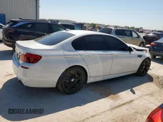 2015 BMW M5 z VIN WBSFV9C54FD594450, wystawiony jako Copart lot #52173915 z przebiegiem 67 267 mil mil oraz Szkoda całkowita • Salvage title. Historia ofert i sprzedaży dostępna na DreamBid. Obrazek 3.