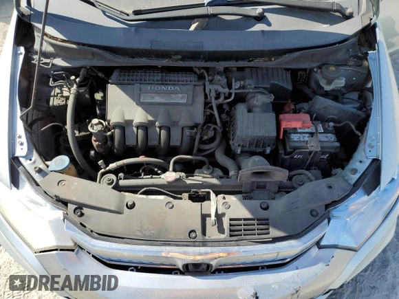 2012 Honda Insight EX z VIN JHMZE2H7XCS002156, wystawiony jako Copart lot #50825825 z przebiegiem 425 939 mil mil oraz Szkoda całkowita • Salvage title. Historia ofert i sprzedaży dostępna na DreamBid. Obrazek 11.