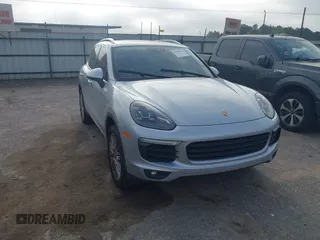 2016 Porsche Cayenne S E-Hybrid with VIN WP1AE2A26GLA59496, listed as a IAAI auction lot 41884022 with 85,386 mi miles and . Bid and sale history available at DreamBid. Image 1.