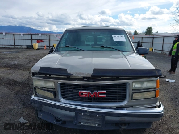 1999 GMC Yukon with VIN 1GKEK13R2XJ712390, listed as a IAAI auction lot 41793649 with 222,721 mi miles. Bid and sale history available at carsss.com. Image 13.