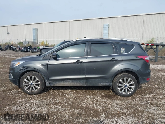 2017 Ford Escape Titanium with VIN 1FMCU9J98HUA49434, listed as a IAAI auction lot 40710866 with 143,850 mi miles. Bid and sale history available at carsss.com. Image 14.