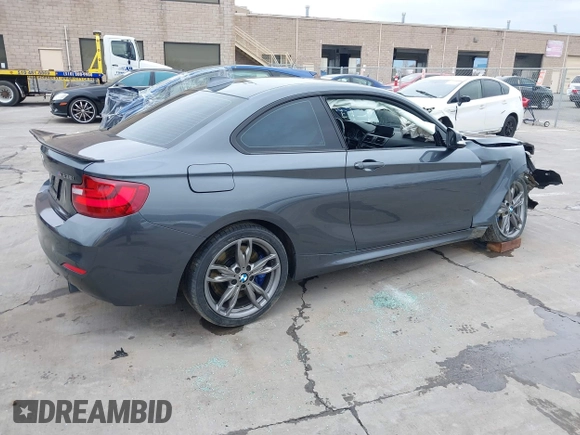 2015 BMW 2 Series M235i with VIN WBA1J7C50FV358774, listed as a IAAI auction lot 41559637 with 82,344 mi miles and . Bid and sale history available at carsss.com. Image 4.