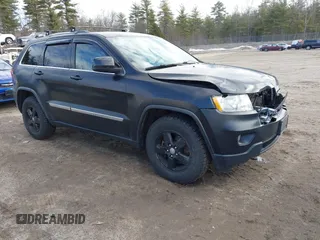 2011 Jeep Grand Cherokee Laredo with VIN 1J4RR4GG5BC670369, listed as a IAAI auction lot 41892892 with 164,807 mi miles. Bid and sale history available at carsss.com. Image 1.