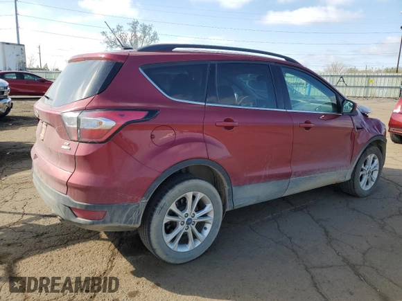 2018 Ford Escape SE z VIN 1FMCU9GD0JUC29279, wystawiony jako Copart lot #54511595 z przebiegiem 77 547 mil mil oraz Czysty tytuł • Clean title. Historia ofert i sprzedaży dostępna na DreamBid. Obrazek 3.