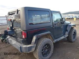 2014 Jeep Wrangler Sahara with VIN 1C4AJWBG5EL247812, listed as a IAAI auction lot 40909884 with 106,475 mi miles and . Bid and sale history available at DreamBid. Image 4.