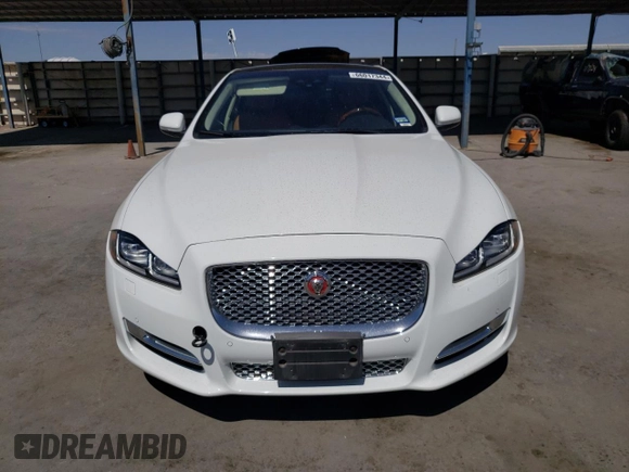2019 Jaguar XJ Portfolio with VIN SAJWA2G72K8W21087, listed as a Copart auction lot 66017344 with 22,671 mi miles and Salvage Title. Bid and sale history available at DreamBid. Image 5.