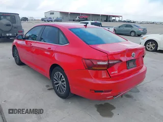 2019 Volkswagen Jetta S z VIN 3VWC57BUXKM099060, wystawiony jako IAAI lot #41478697 z przebiegiem 134 363 mil mil oraz . Historia ofert i sprzedaży dostępna na DreamBid. Obrazek 3.
