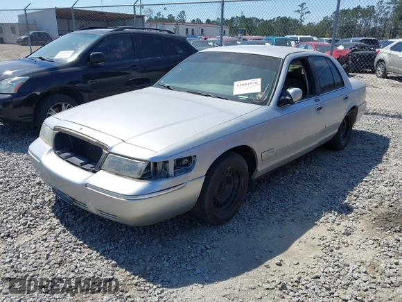 2001 Mercury Grand Marquis GS z VIN 2MEFM74W71X671429, wystawiony jako IAAI lot #41684570 z przebiegiem 155 334 mil mil oraz . Historia ofert i sprzedaży dostępna na DreamBid. Obrazek 2.