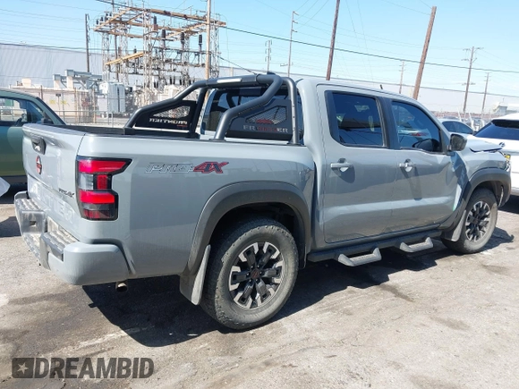 2023 Nissan Frontier Pro-4X z VIN 1N6ED1EKXPN641323, wystawiony jako IAAI lot #42227180 z przebiegiem 25 199 mil mil oraz . Historia ofert i sprzedaży dostępna na DreamBid. Obrazek 4.