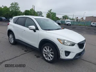 2015 Mazda CX-5 Grand Touring with VIN JM3KE4DY5F0530854, listed as a IAAI auction lot 42274582 with 144,732 mi miles and . Bid and sale history available at DreamBid. Image 1.