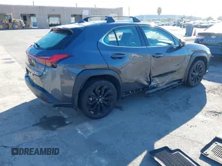 2022 Lexus UX with VIN JTHX3JBH6N2056436, listed as a IAAI auction lot 41856541 with 12,815 mi miles. Bid and sale history available at carsss.com. Image 4.