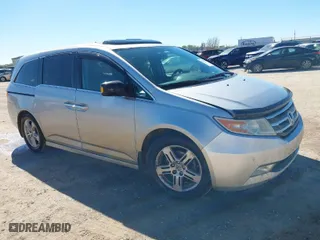 2013 Honda Odyssey Touring with VIN 5FNRL5H93DB076463, listed as a IAAI auction lot 41819994 with 188,911 mi miles. Bid and sale history available at carsss.com. Image 1.