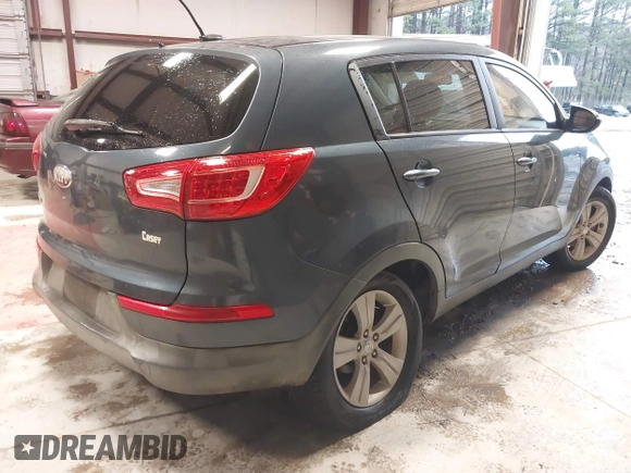 2013 Kia Sportage LX with VIN KNDPB3A2XD7446504, listed as a IAAI auction lot 41271313 with 94,646 mi miles and . Bid and sale history available at DreamBid. Image 4.