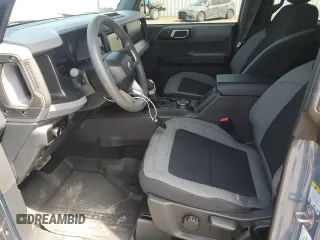 2023 Ford Bronco with VIN 1FMEE5DP0PLB17111, listed as a Copart auction lot 53201215 with 26,093 mi miles and Salvage Title. Bid and sale history available at DreamBid. Image 7.