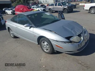 2002 Saturn SC with VIN 1G8ZY14732Z144888, listed as a IAAI auction lot 41617831 with 138,564 mi miles. Bid and sale history available at carsss.com. Image 1.
