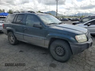 2004 Jeep Grand Cherokee Laredo with VIN 1J4GX48N94C397241, listed as a Copart auction lot 49183315 with 189,099 mi miles and Salvage title. Bid and sale history available at DreamBid. Image 4.