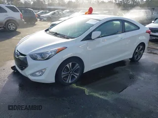 2013 Hyundai Elantra Coupe SE with VIN KMHDH6AE3DU010717, listed as a IAAI auction lot 41832406 with 232,929 mi miles. Bid and sale history available at carsss.com. Image 2.