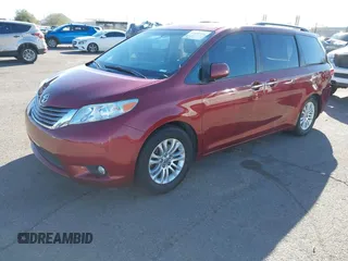 2015 Toyota Sienna XLE with VIN 5TDYK3DCXFS621190, listed as a IAAI auction lot 41646481 with 173,817 mi miles. Bid and sale history available at carsss.com. Image 2.