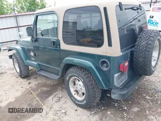 1999 Jeep Wrangler Sahara with VIN 1J4FY49S5XP482037, listed as a IAAI auction lot 42341723 with 161,081 mi miles and . Bid and sale history available at DreamBid. Image 3.