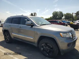 2012 Jeep Grand Cherokee Laredo with VIN 1C4RJEAG0CC104004, listed as a Copart auction lot 53734675 with 150,216 mi miles and Salvage Title. Bid and sale history available at carsss.com. Image 4.