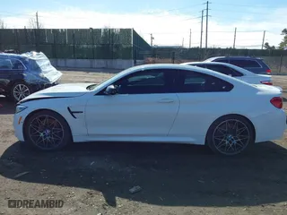 2019 BMW M4 with VIN WBS4Y9C5XKAG67446, listed as a IAAI auction lot 41669865 with 103,230 mi miles. Bid and sale history available at carsss.com. Image 14.