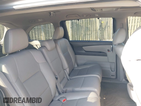 2014 Honda Odyssey Touring with VIN 5FNRL5H95EB108427, listed as a IAAI auction lot 39992643 with 100,658 mi miles and . Bid and sale history available at DreamBid. Image 8.