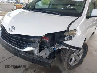 2014 Toyota Sienna LE AAS with VIN 5TDKK3DC4ES505293, listed as a IAAI auction lot 42021409 with 70,319 mi miles. Bid and sale history available at carsss.com. Image 6.