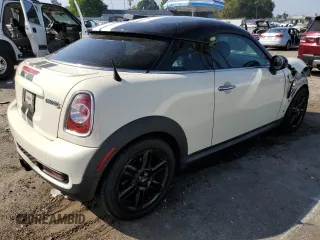 2013 MINI Coupe S z VIN WMWSX3C59DT466931, wystawiony jako Copart lot #75463804 z przebiegiem Nie podano mil oraz Szkody całkowita. Historia ofert i sprzedaży dostępna na DreamBid. Obrazek 3.