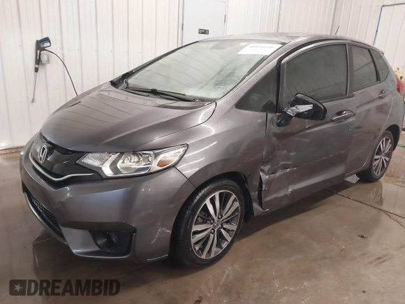 2015 Honda Fit EX-L with VIN 3HGGK5H85FM755006, listed as a IAAI auction lot 41034606 with 97,294 mi miles and . Bid and sale history available at DreamBid. Image 2.