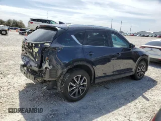 2018 Mazda CX-5 Grand Touring with VIN JM3KFBDM8J0474819, listed as a Copart auction lot 48580545 with 76,917 mi miles and Salvage Title. Bid and sale history available at DreamBid. Image 3.