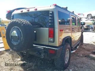2005 Hummer H2 SUV with VIN 5GRGN23U85H129007, listed as a IAAI auction lot 41625417 with 102,389 mi miles. Bid and sale history available at carsss.com. Image 4.