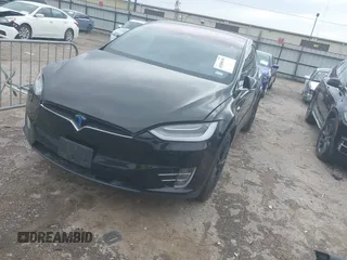 2021 Tesla Model X Long Range Plus with VIN 5YJXCAE27MF324270, listed as a IAAI auction lot 41886101 with 59,614 mi miles and . Bid and sale history available at carsss.com. Image 2.