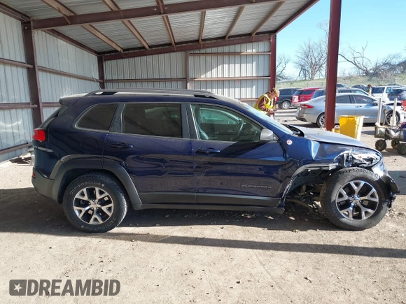 2015 Jeep Cherokee Trailhawk with VIN 1C4PJMBB1FW520649, listed as a IAAI auction lot 41991904 with 168,533 mi miles and . Bid and sale history available at DreamBid. Image 14.