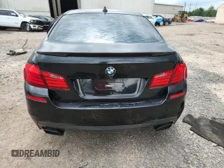 2013 BMW 5 Series 550i xDrive with VIN WBAFU9C55DDY72065, listed as a Copart auction lot 63023675 with 117,592 mi miles and Salvage title. Bid and sale history available at DreamBid. Image 6.