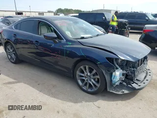 2016 Mazda 6 i Grand Touring with VIN JM1GJ1W59G1439075, listed as a IAAI auction lot 41792755 with 99,215 mi miles and . Bid and sale history available at DreamBid. Image 1.