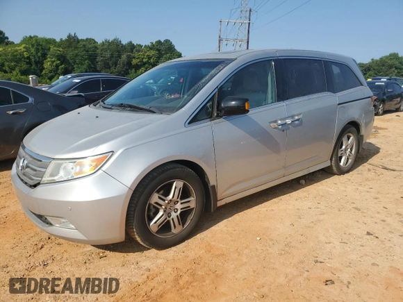 2012 Honda Odyssey Touring с VIN 5FNRL5H93CB137468, выставлен на аукционе Copart как лот 59330545 с пробегом 105 880 миль миль и Списание • Salvage title. История ставок и продаж доступна на DreamBid. Изображение 1.