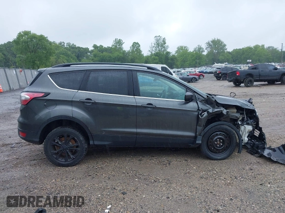 2017 Ford Escape SE z VIN 1FMCU9G95HUC83618, wystawiony jako IAAI lot #42324672 z przebiegiem 132 910 mil mil oraz . Historia ofert i sprzedaży dostępna na DreamBid. Obrazek 13.