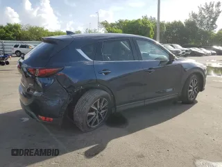 2018 Mazda CX-5 Grand Touring with VIN JM3KFADMXJ1353942, listed as a Copart auction lot 60570835 with 74,400 mi miles and Clean title. Bid and sale history available at DreamBid. Image 3.
