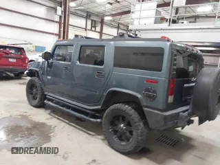 2005 Hummer H2 SUV with VIN 5GRGN23U65H132505, listed as a IAAI auction lot 41515346 with 140,944 mi miles. Bid and sale history available at carsss.com. Image 3.
