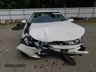 2023 Toyota Corolla Hybrid LE with VIN JTDBDMHE2PJ002549, listed as a Copart auction lot 50378594 with 5,028 mi miles and Salvage Title. Bid and sale history available at carsss.com. Image 5.
