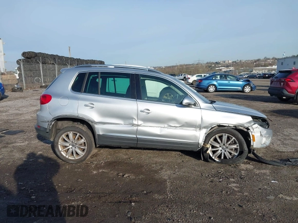 2013 Volkswagen Tiguan S with VIN WVGAV3AX0DW572915, listed as a IAAI auction lot 41937763 with 65,136 mi miles and . Bid and sale history available at DreamBid. Image 13.