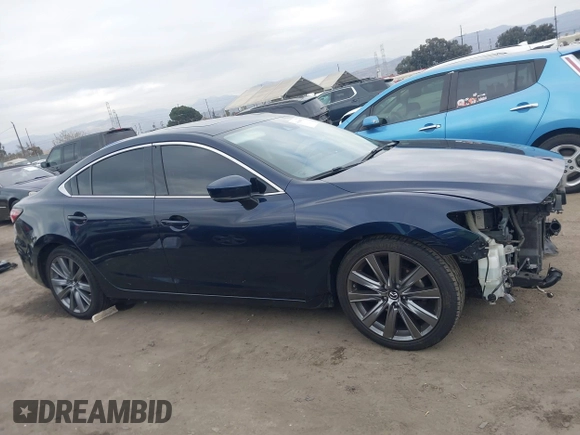 2018 Mazda 6 Grand Touring with VIN JM1GL1TY3J1334600, listed as a IAAI auction lot 41060893 with 64,852 mi miles and . Bid and sale history available at DreamBid. Image 14.