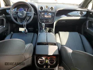 2019 Bentley Bentayga V8 z VIN SJAAM2ZV7KC025449, wystawiony jako Copart lot #62903583 z przebiegiem 12 615 mil mil oraz . Historia ofert i sprzedaży dostępna na DreamBid. Obrazek 8.