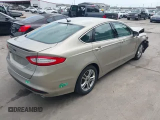 2015 Ford Fusion Energi Titanium with VIN 3FA6P0SU3FR114739, listed as a IAAI auction lot 42003011 with 120,553 mi miles. Bid and sale history available at carsss.com. Image 4.