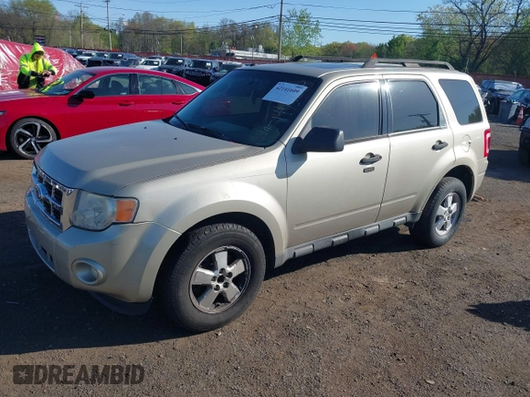 2010 Ford Escape XLT with VIN 1FMCU9D75AKB64794, listed as a IAAI auction lot 42141609 with 118,791 mi miles. Bid and sale history available at carsss.com. Image 2.