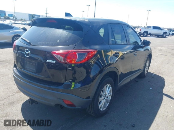 2013 Mazda CX-5 Touring with VIN JM3KE2CEXD0153589, listed as a IAAI auction lot 41855356 with 86,030 mi miles and . Bid and sale history available at DreamBid. Image 4.